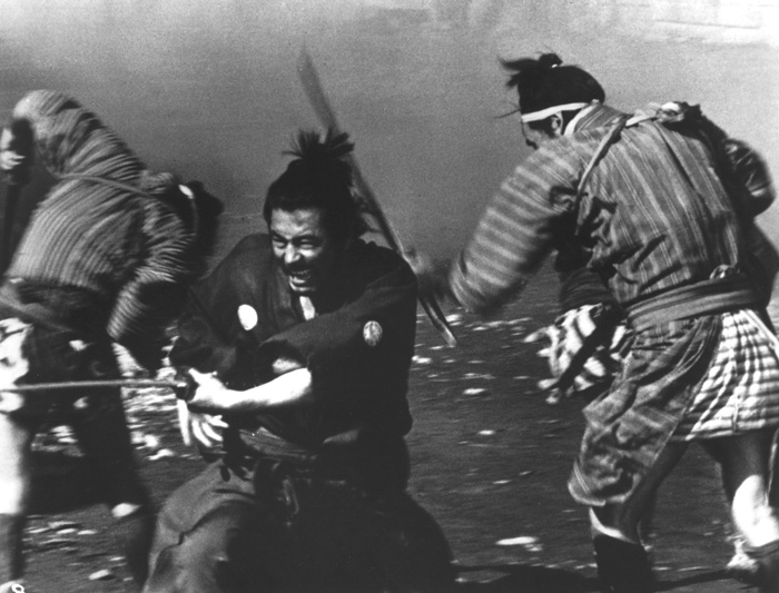  MIDDLEMEN: At the start of Yojimbo, Kurosawa frames an argument between father and son with Mifune placed strategically between them.” - photo courtesy Criterion Collection - click link for IMDB info.